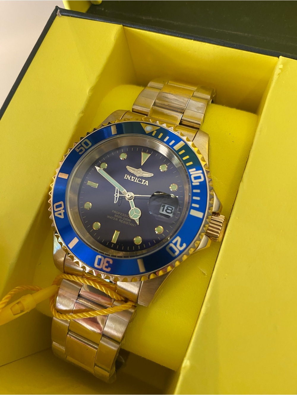 Invicta Gold Tone Watch with Blue Bezel and Dial